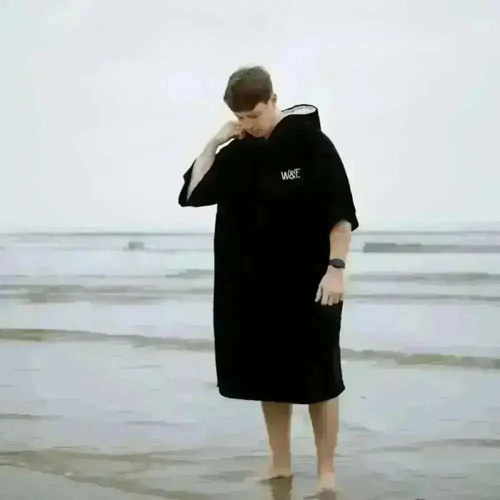Black hooded towel robe with white chest logo in cotton-polyester blend