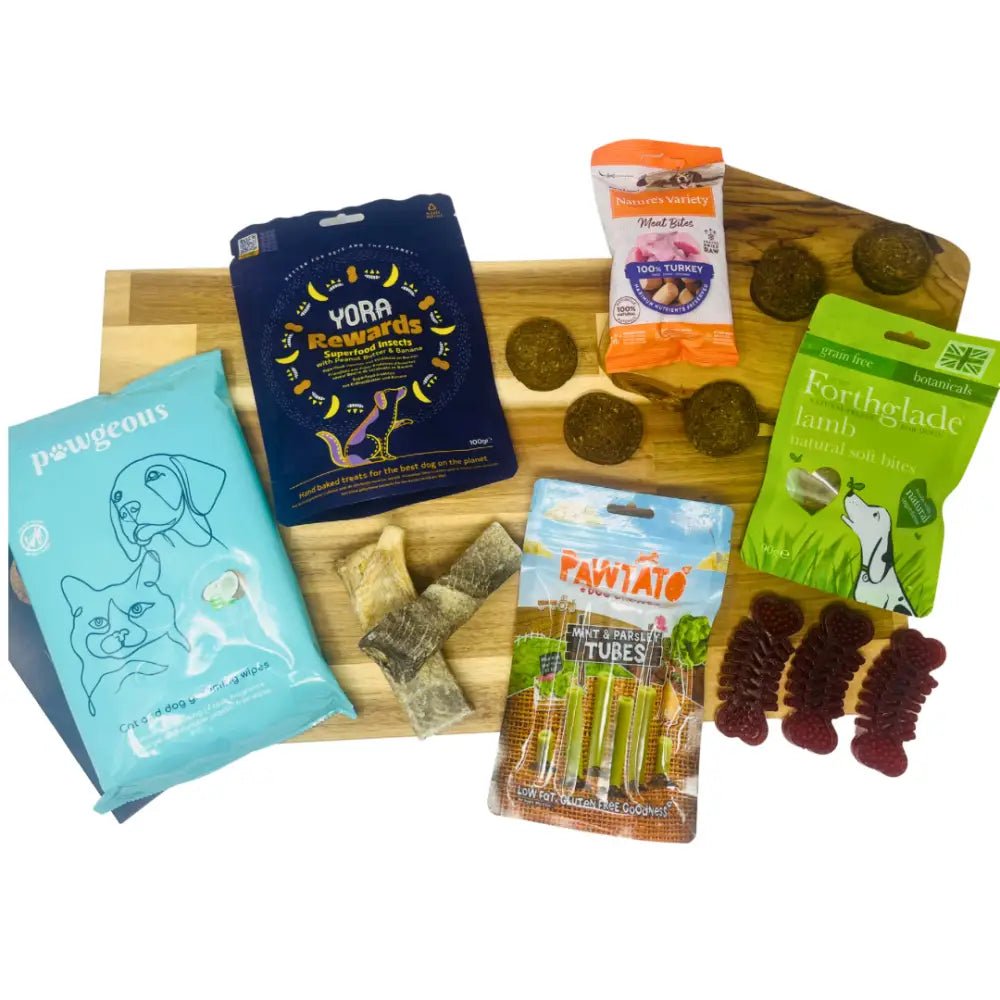 Blue cat treat bag with paw print design and Pawgeous branding for monthly treat subscription