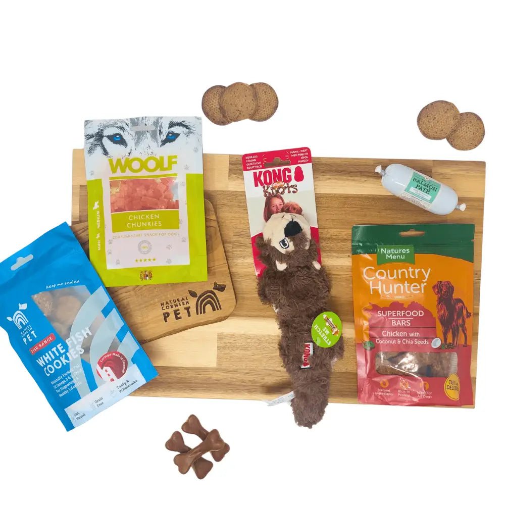 Wooden cutting board with monthly dog treats and creepy cuties rope toy for pets