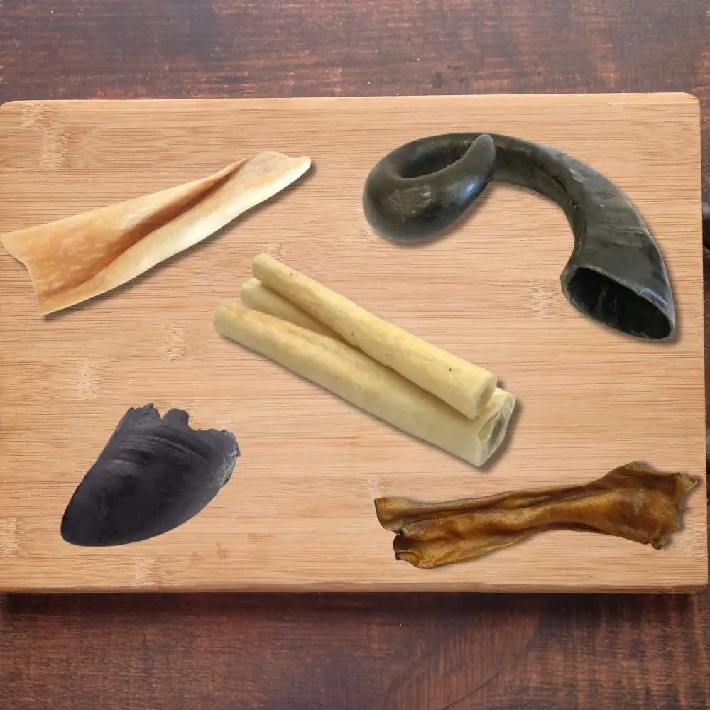 Tough Chew Box: Wooden board with natural dog treats and black horn chew