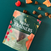 Tribal Trainers air dried meaty treats packaging on a teal background with treats around.