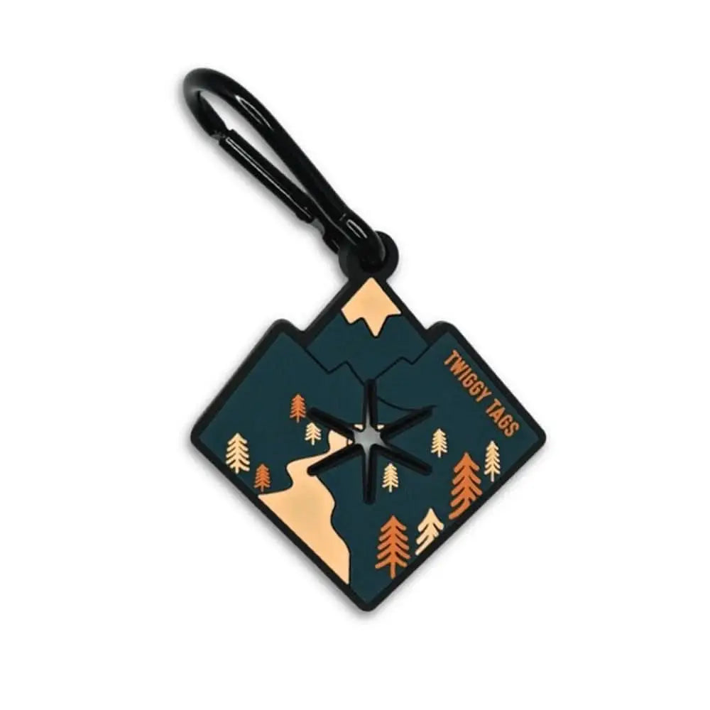 Twiggy Tags Porta-Poop Alpine luggage tag with compass, carabiner, dark teal background, gold trees