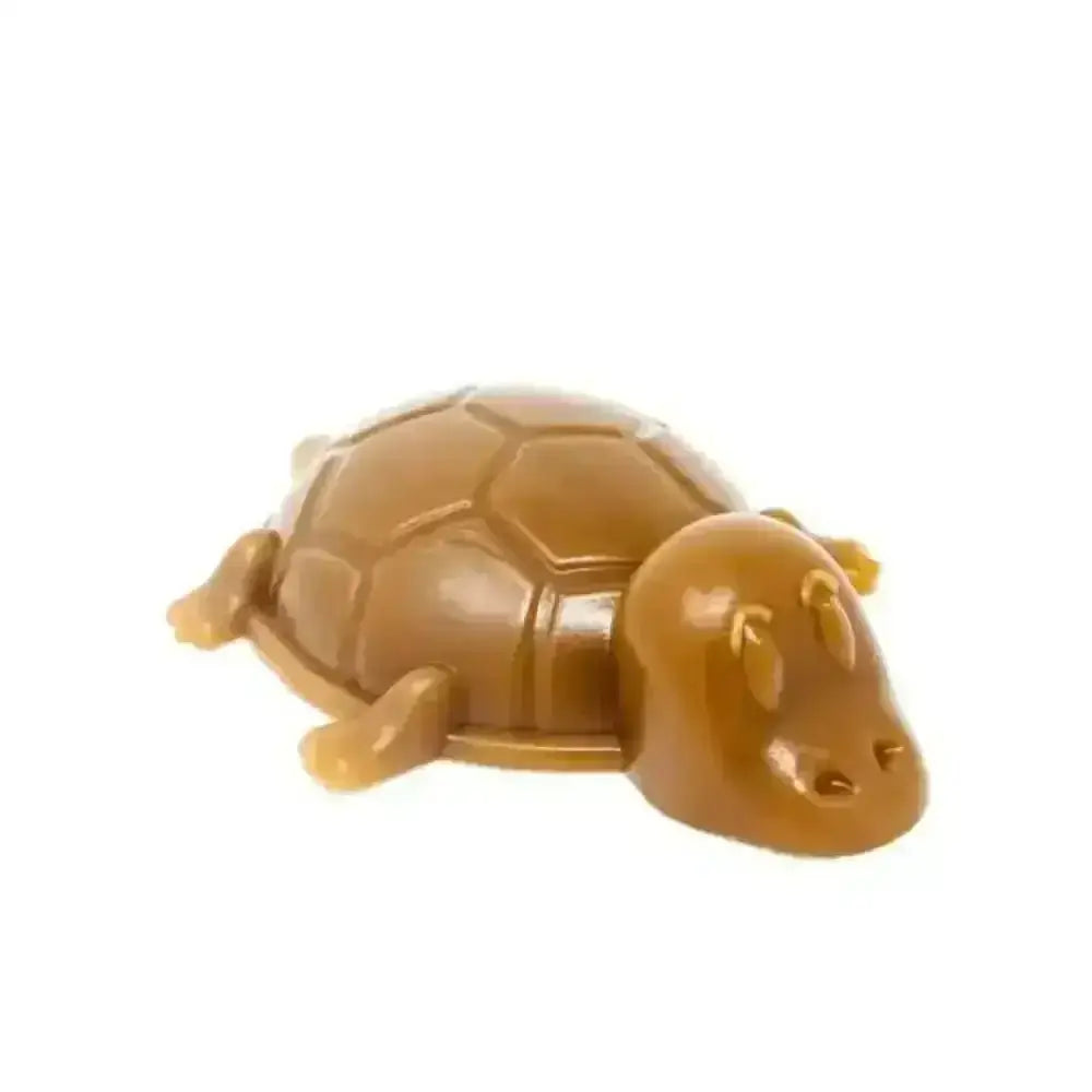 Golden plastic tortoise figurine chew for dogs with peanut butter turtles flavor for dental health