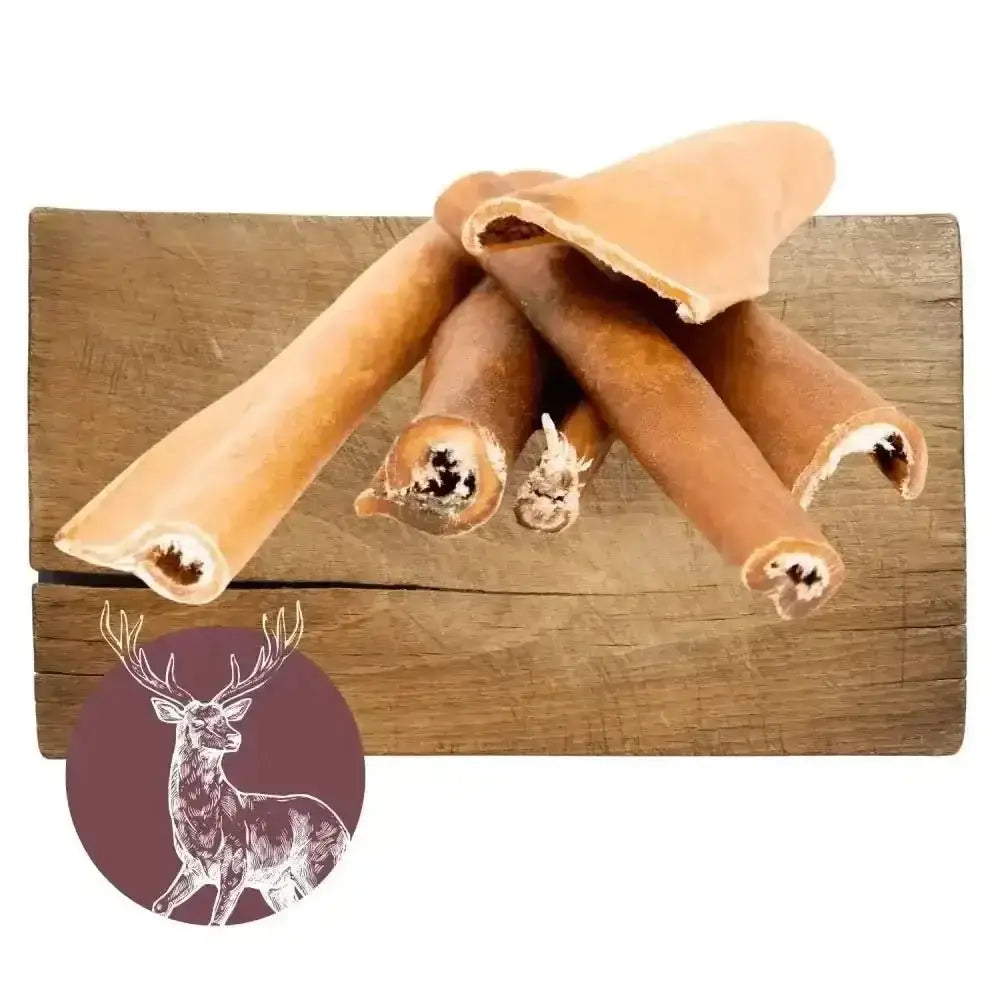 Venison Skin Natural Meat Chew for Dogs with Deer Jerky Sticks on Wooden Board