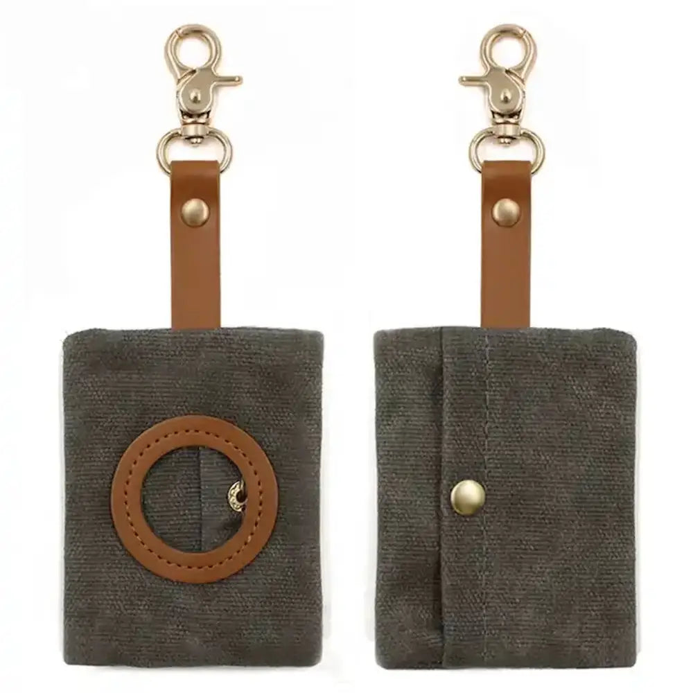 Olive green waxed canvas poop bag holder with brown leather strap