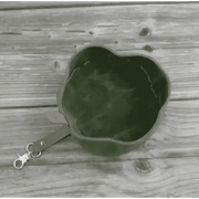 Introducing Dapper Dog’s waxed canvas travel dog bowl in olive green with leather strap
