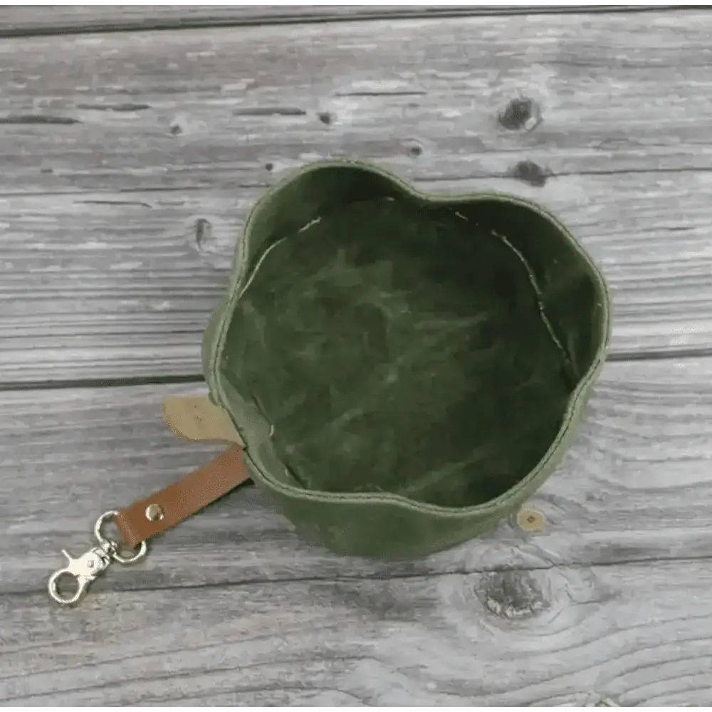 Introducing Dapper Dog’s waxed canvas travel dog bowl in olive green with leather strap