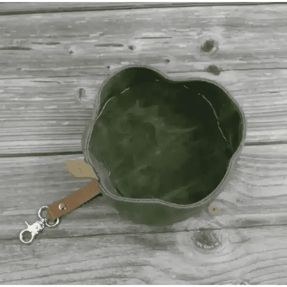 Introducing Dapper Dog’s waxed canvas travel dog bowl in olive green with leather strap