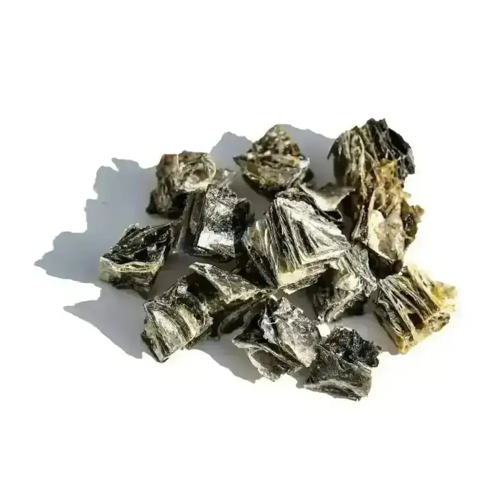 Black and white jagged rock pile with White Fish Cubes for Dogs featuring natural fish