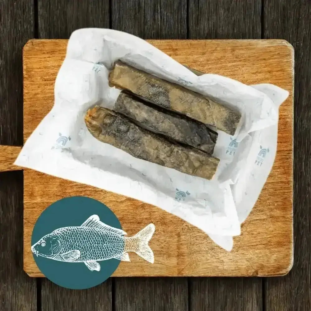 Wolf fish stick chew box with dried wolf fish in white paper on wooden board
