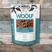 Woolf Soft Duck Chunkies dog treats in teal and white packaging with paw prints, high crude protein