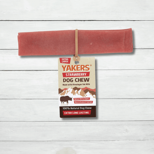 Yakers Strawberry Yak Chew sits on a rustic background. This product can be bought at The Pets Larder natural pet store