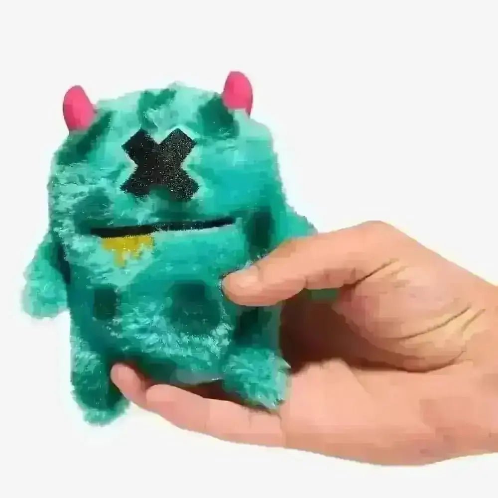 Teal plush dog toy Mr.X with pink horns and glittery black eyes
